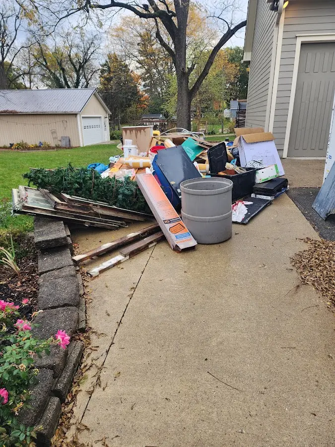 Dumpster being loaded with debris for Commercial Dumpster Rental in Trenton